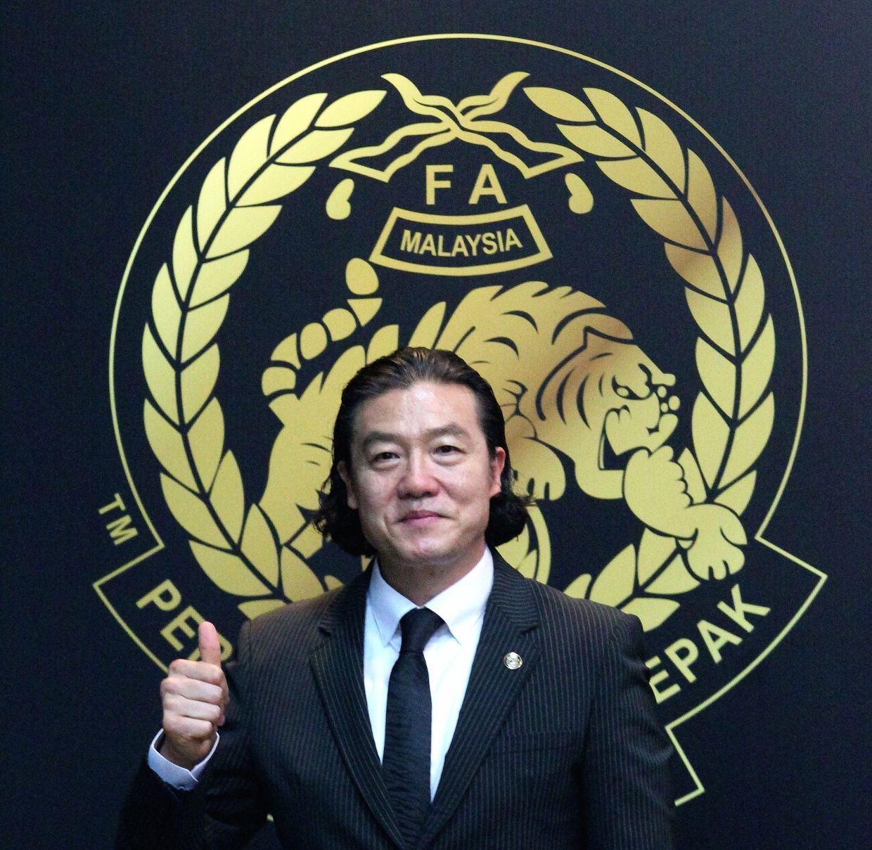 introduce the new national  coach, Kim Pan Gon. — AZLINA ABDULLAH/The Star