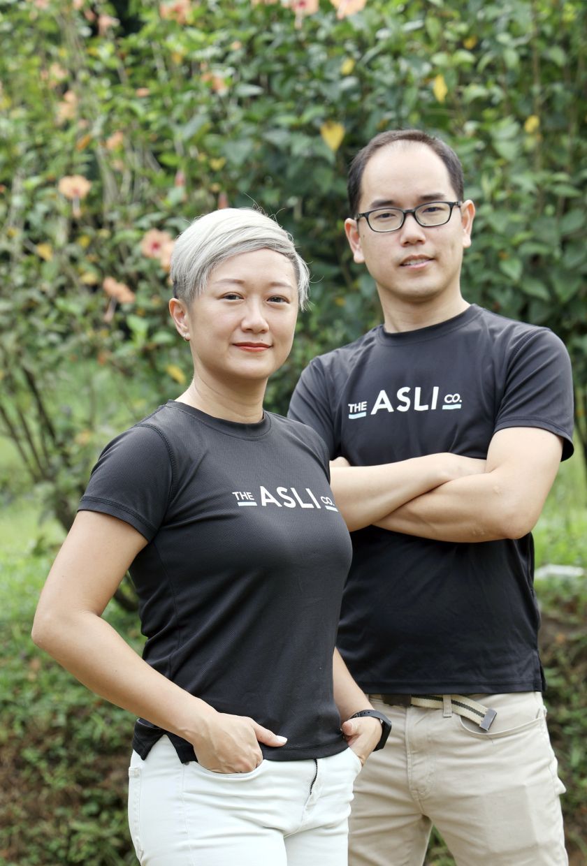 Lim Xin Yu (left) and Jason Wee, founders of The Asli Co. social enterprise that empowers Orang Asli mothers to earn a stable income to support their families. — ART CHEN/The Star