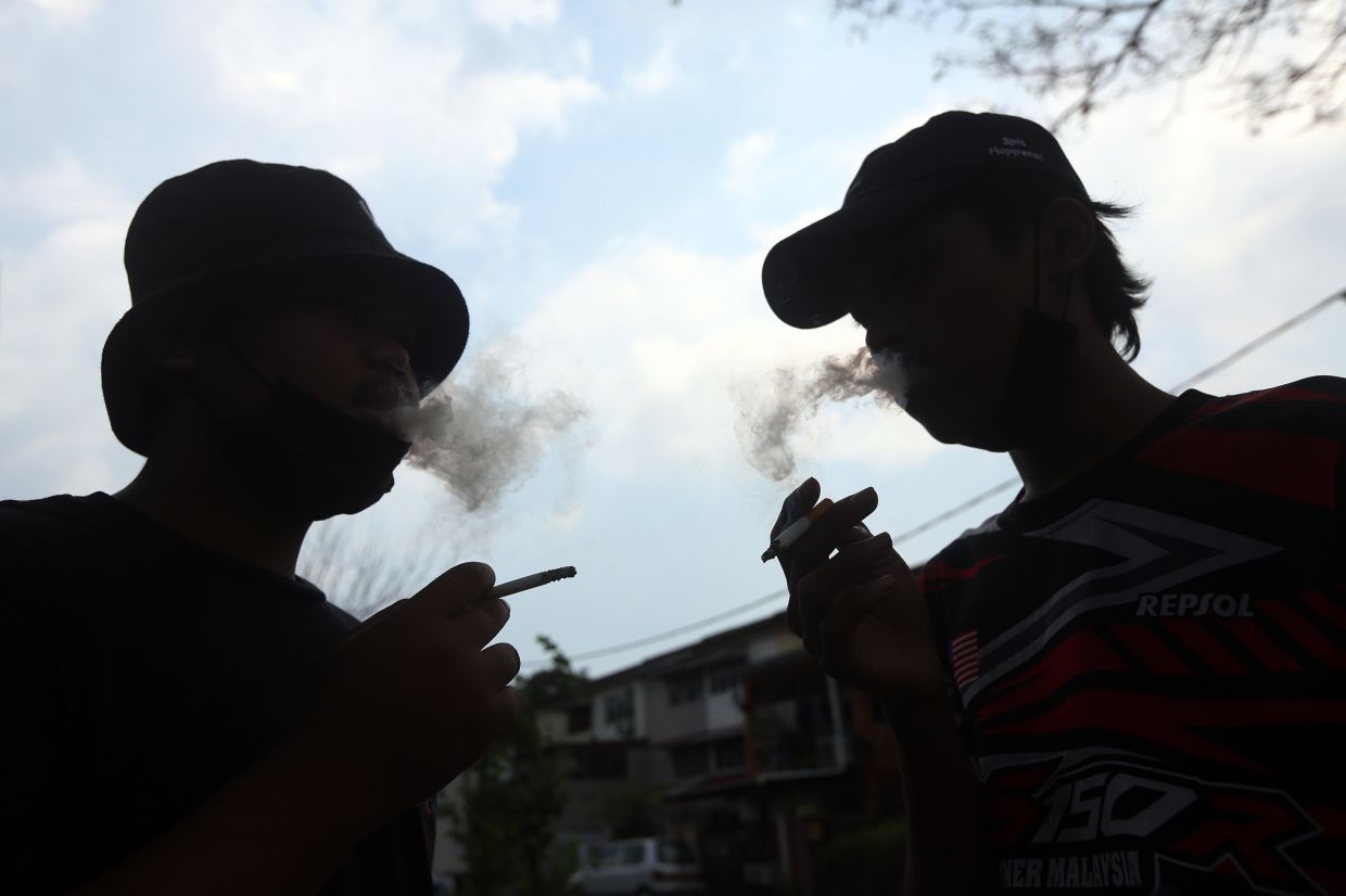 Picture posed by model for Photo concept on the idea of banning the teenagers born in 2005 from buying and smoking. — IZZRAFIQ ALIAS/The Star.