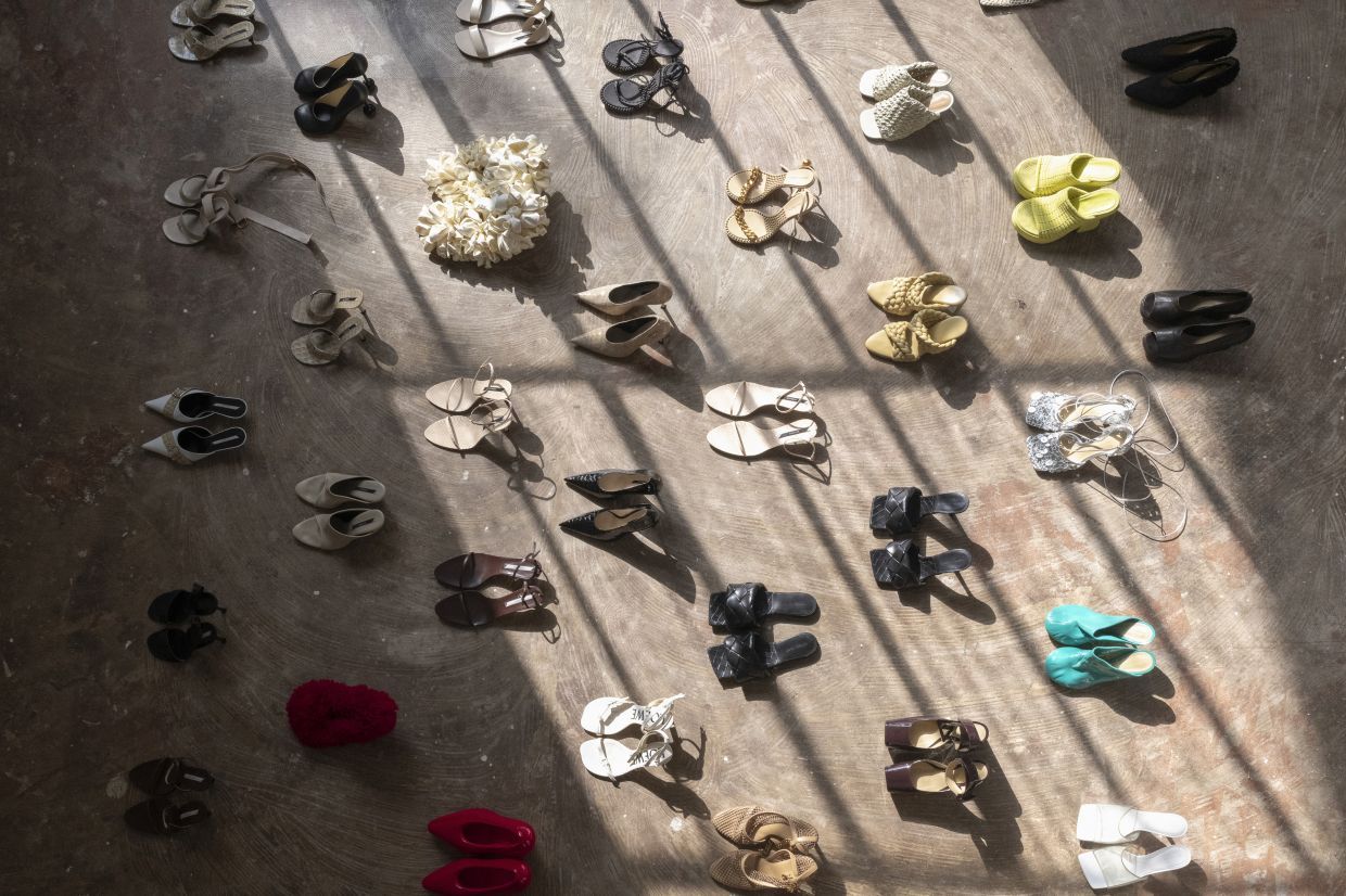 Dozens of Nina Christen’s shoe designs — Bottega Veneta, Loewe and Celine, among them — arranged in a grid in her home studio in Paris, June 26, 2025. Christen, who designed some of the most influential shoes of the past decade, now has a line of her own. (Dmitry Kostyukov/The New York Times)