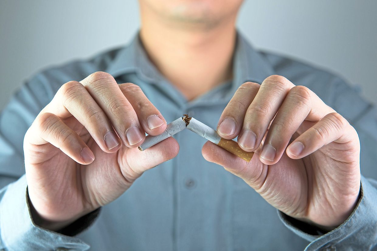 Stop smoking message shown by breaking a cigarette