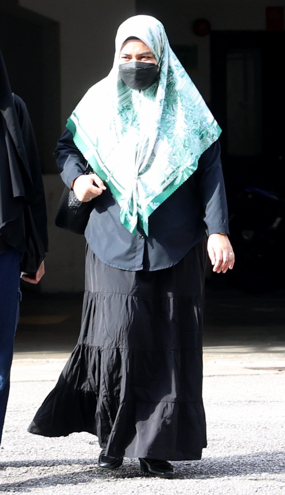 (center) Mother of Zayn Rayyan, Ismanira Abdul Manaf at the court case on 