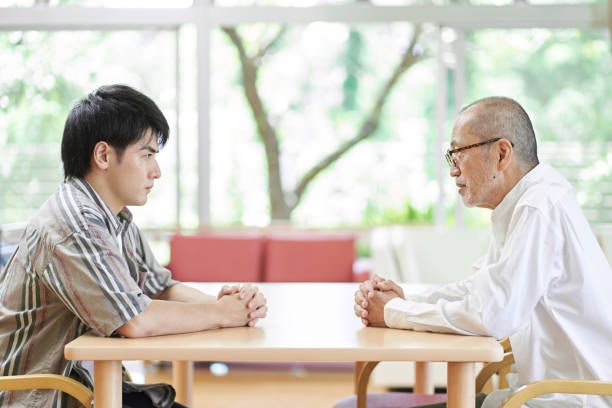 Young men and older men fighting