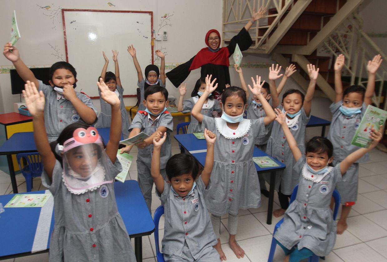 Qdees pre school children happy to be back at school on their first day of schooling after the goventment announced that kindergarden are allowed to re-open strating 1st of July with Covid-19 SOPs to be strictly followed. AZLINA ABDULLAH/The Star
