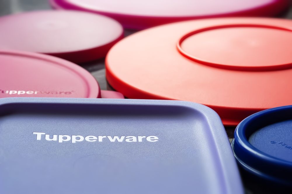 Tupperware lids. Lids for dishes with the Tupperware brand logo in full frame. Textured image with shallow depth of field. Ukraine. Kyiv. Jun.02.2023