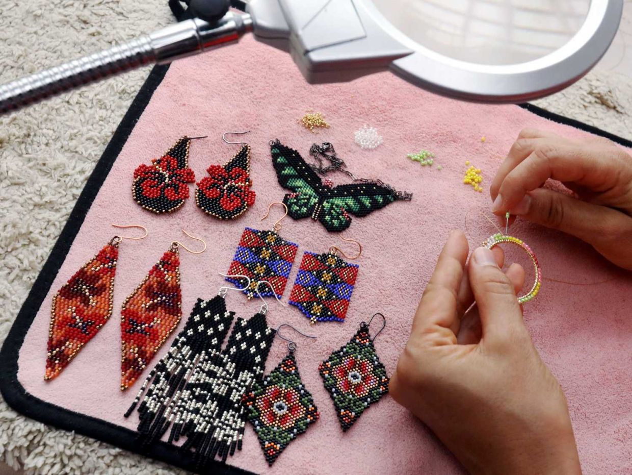 Lifestyle cover photoshoot of Mrs Sharmila who has made Malaysian-themed beaded earrings for Merdeka story. — AZLINA ABDULLAH/The Star