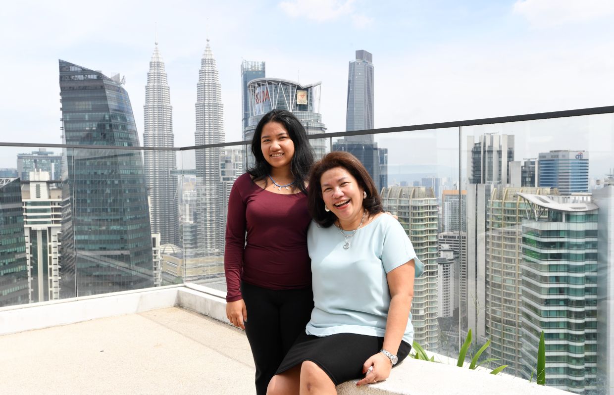 Book author Shera Fadzlin and her daughter Saiffya co autored the book Gutsy Asian. .—AZHAR MAHFOF/The Star