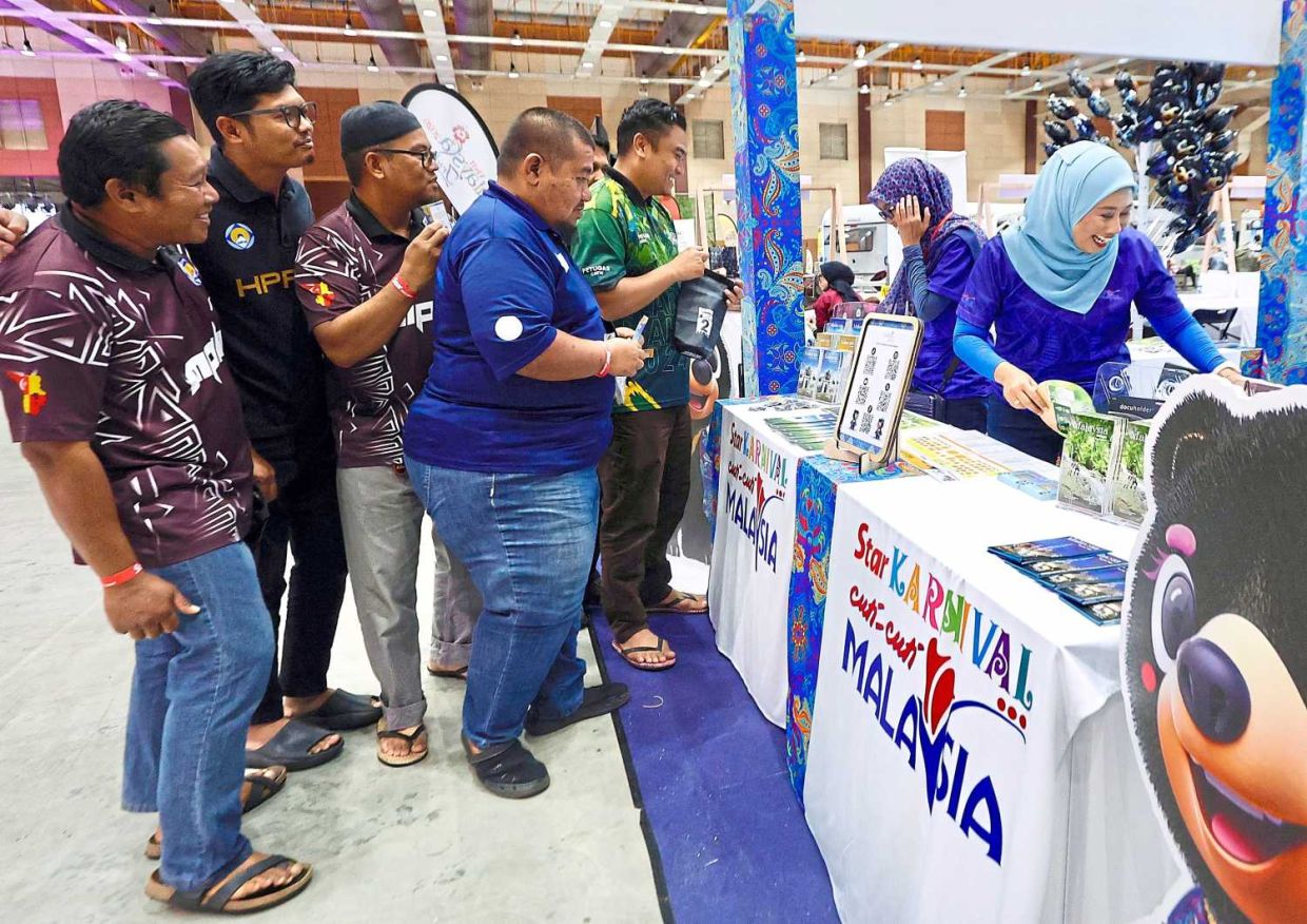 Visitors make a visit and join the activities at Tourism Malaysia booth inconjuction of The Great Outdoor Expo 2025 at Malaysia Exposition Park Serdang. — FAIHAN GHANI/The Star