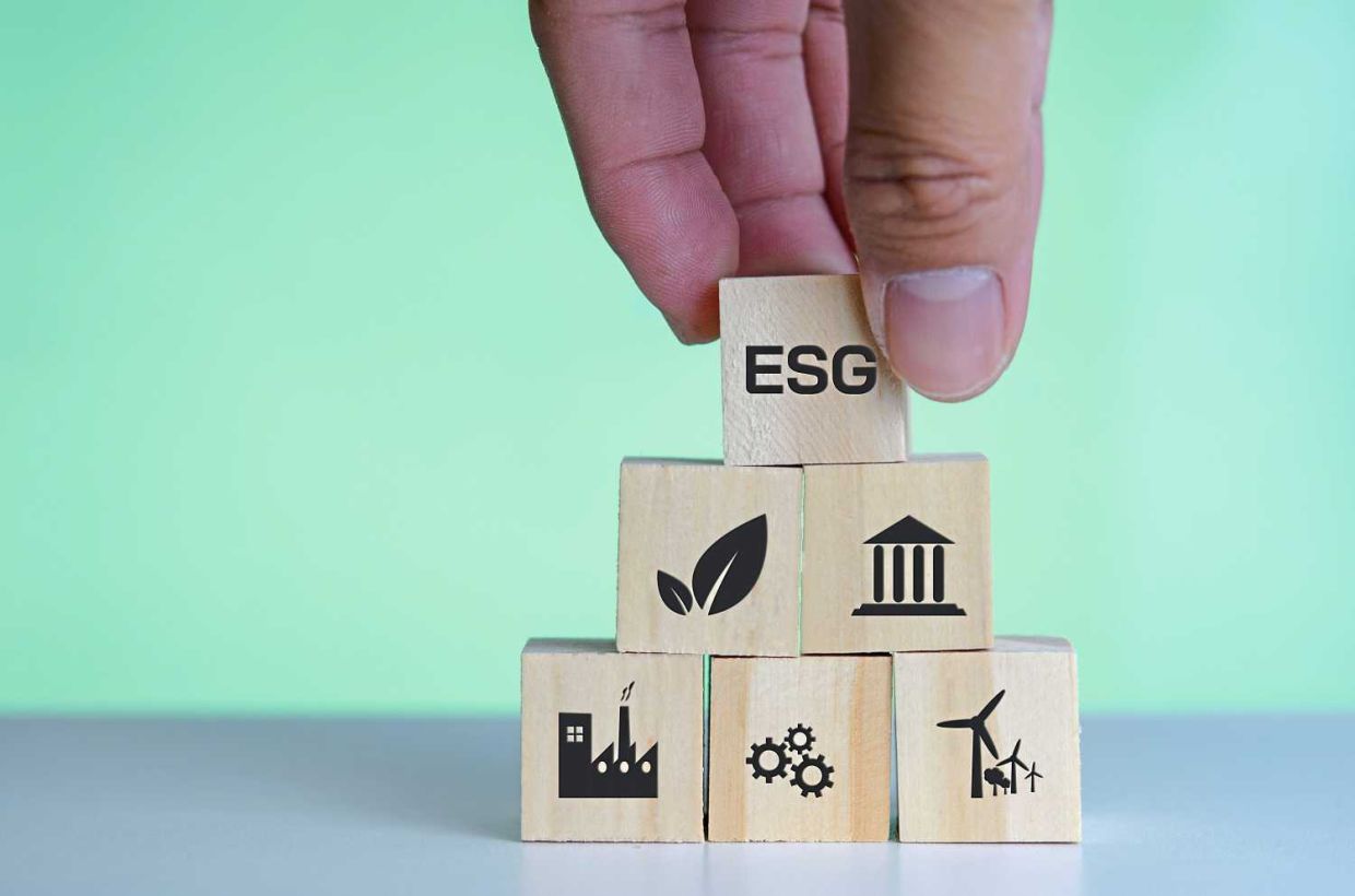 Wooden cubes with ESG Environmental social and governance symbol on background and copy space.Business concepts.