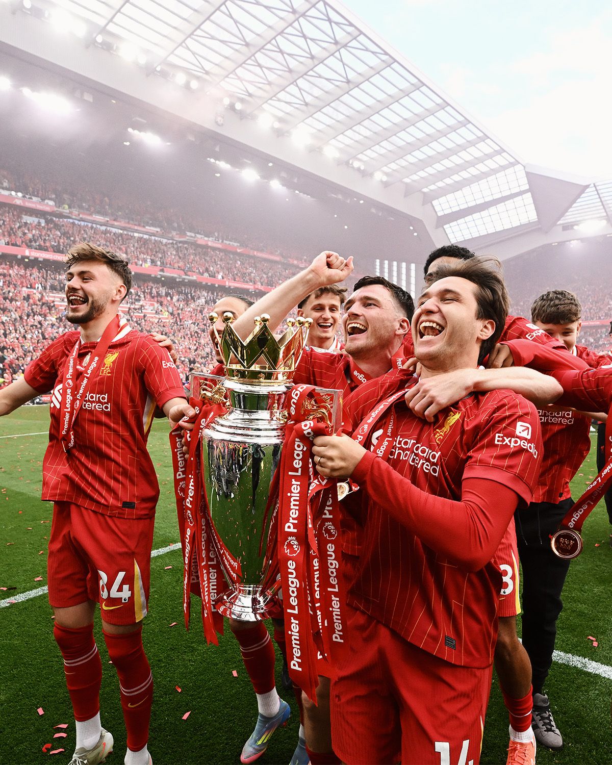 LIVERPOOL, ENGLAND - MAY 25: (THE SUN OUT. THE SUN ON SUNDAY OUT) Andrew Robertson, Federico Chiesa and Harvey Elliott of Liverpool celebrate with the Premier League trophy, as Liverpool are crowned the Champions of the Premier League for the 2024/25 Season, following during the Premier League match between Liverpool FC and Crystal Palace FC at Anfield on May 25, 2025 in Liverpool, England. (Photo by Liverpool FC/Liverpool FC via Getty Images)