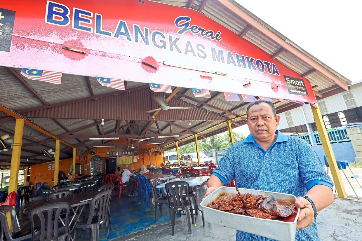 Horseshoe crab restaurant owner Mohd Khair Abdul Hamid, 52, showing sambal horseshoe crab, one of the two most popular dishes at his restaurant. — THOMAS YONG/The Star