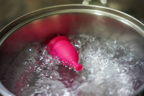 menstrual cup boiling in water. feminine intimate hygiene