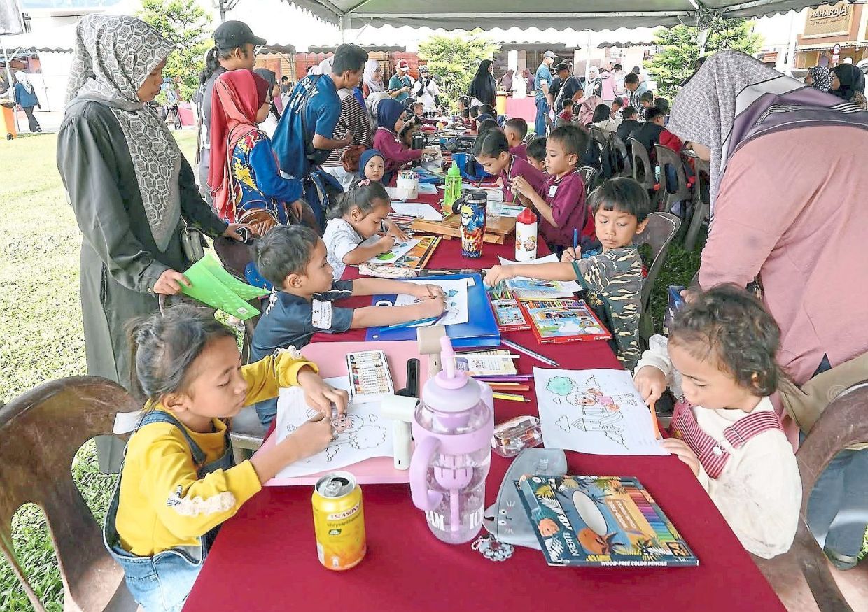 Children participating in the colouring contest.