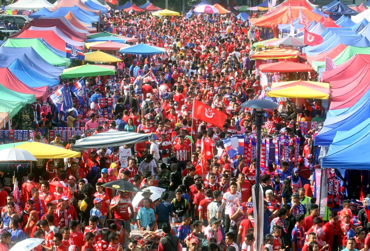 Fans at Bukit Jalil Stadium before the FA cup final match between Johor Darul Takzim and Kelantan...... --M. Azhar Arif/The Star. 29 June 2013.